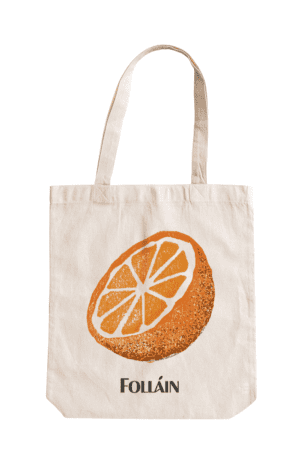 Tote bag featuring an illustration of an orange and text saying "Folláin"