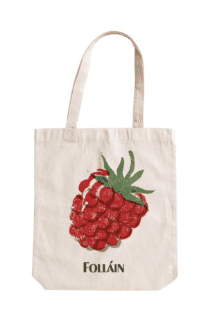Tote bag featuring an illustration of a raspberry and text saying "Folláin"